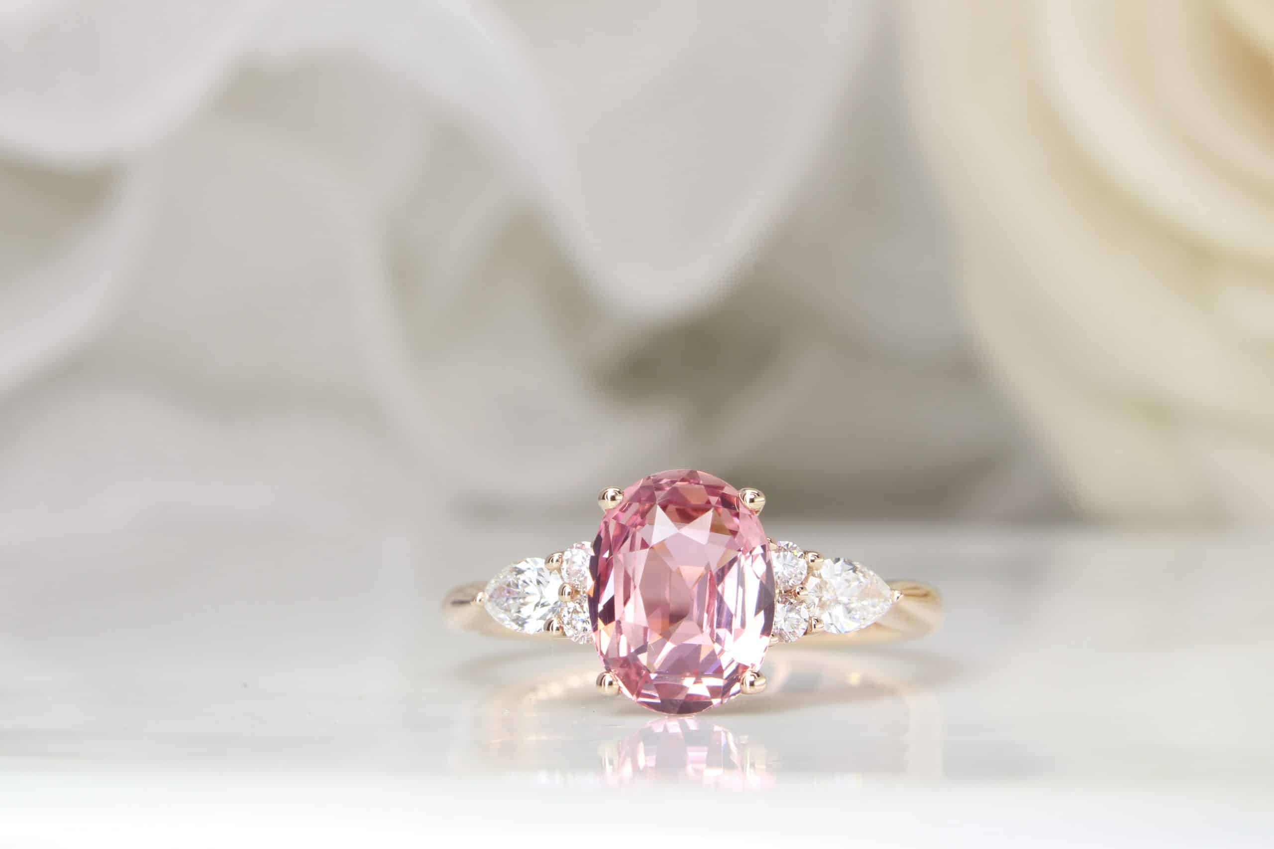 Sapphire Padparadscha with side diamond ring