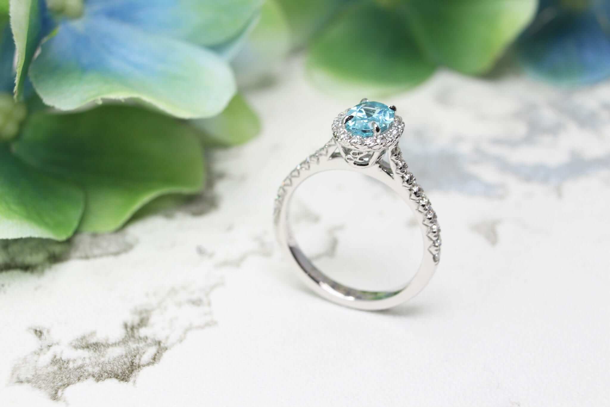 Personalised Engagement Ring with Paraiba Tourmaline Gemstone with unique design for a proposal with own personalised initials on the ring | Customised Jeweller in wedding ring and wedding jewellery with paraiba tourmaline gemstone in Singapore