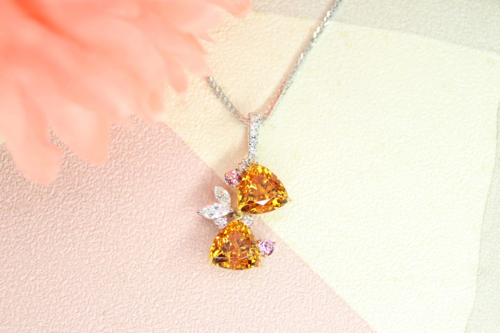 Mandarin Garnet Pendant with a pair of unique Trilliant shapes, a non-traditional Guardian Angel inspired setting with diamond - Singapore Bespoke Fine Jewelry.
