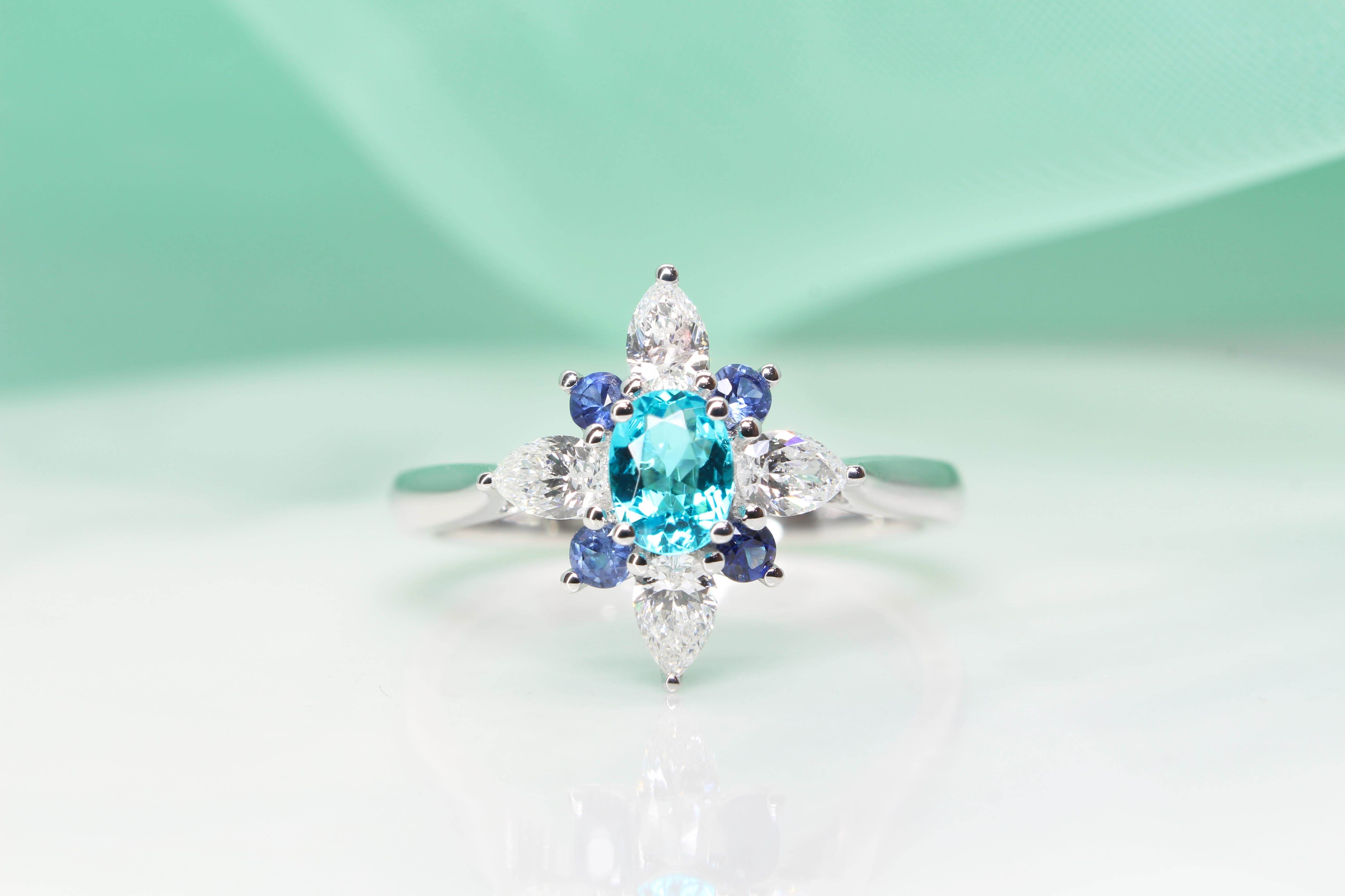 Brazil Paraiba Tourmaline Ring customised and design with pear shaped diamond and round brilliance blue sapphire inspired by a flora design - Customised Engagement Ring with local Singapore bespoke customised jeweller, with Mozambique and Brazil Paraiba