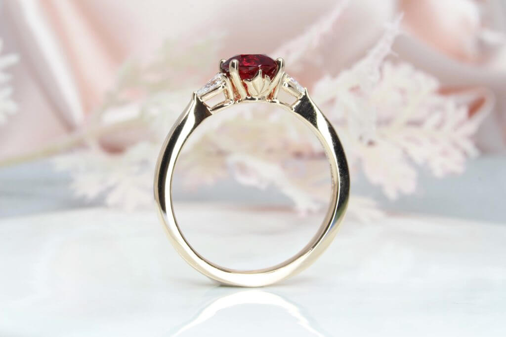Red Spinel custom design with two pear shape diamonds, crafted in rose gold, the detailing on the side bands of the engagement ring for a proposal | Local Singapore custom made jeweller in engagement ring and wedding jewellery with spinel gemstone.