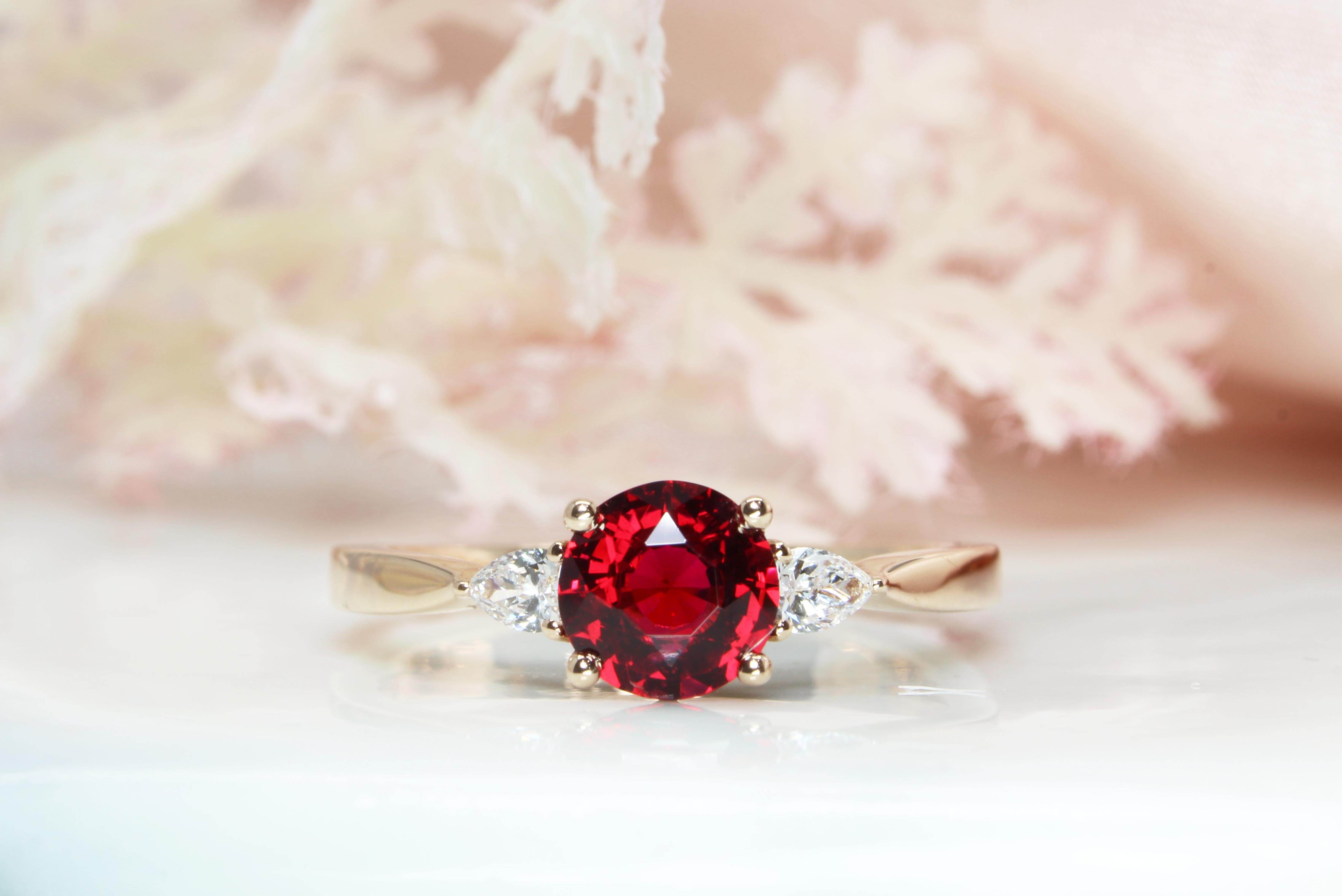 Red Spinel custom design with two pear shape diamonds, crafted in rose gold, the detailing on the side bands of the engagement ring for a proposal | Local Singapore custom made jeweller in engagement ring and wedding jewellery with spinel gemstone Proposal Ring.