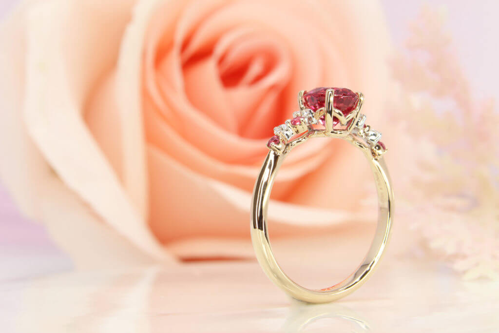 Pinkish Red Spinel Gem designed with round brilliant diamond and similar pinkish red spinel. Customised Wedding proposal ring in Singapore with Spinel Gemstone.